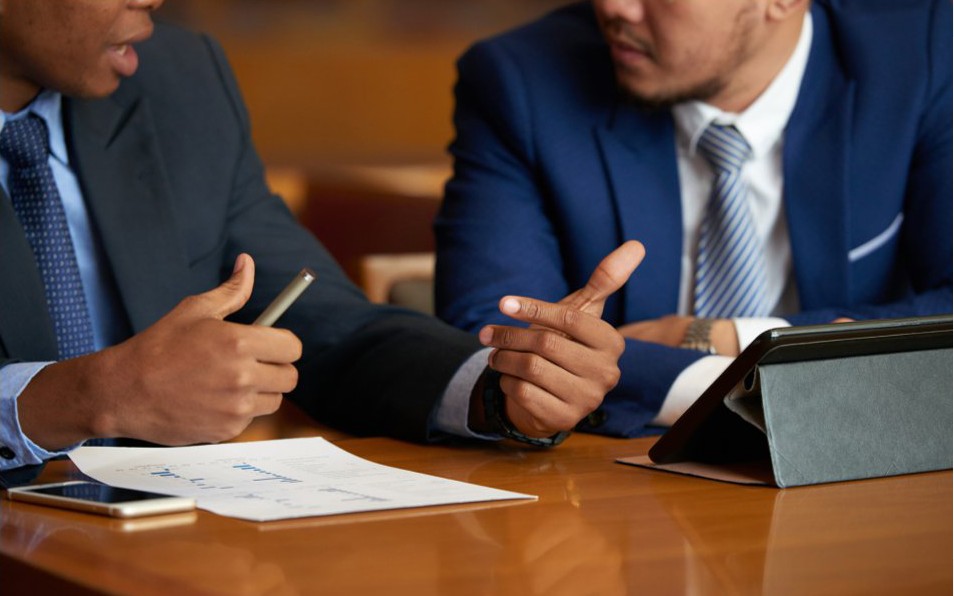 Lawyers reviewing transaction documents with a client